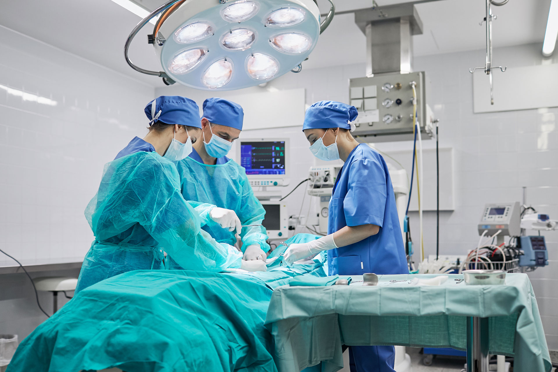 Team of surgeons in operating room at a hospital