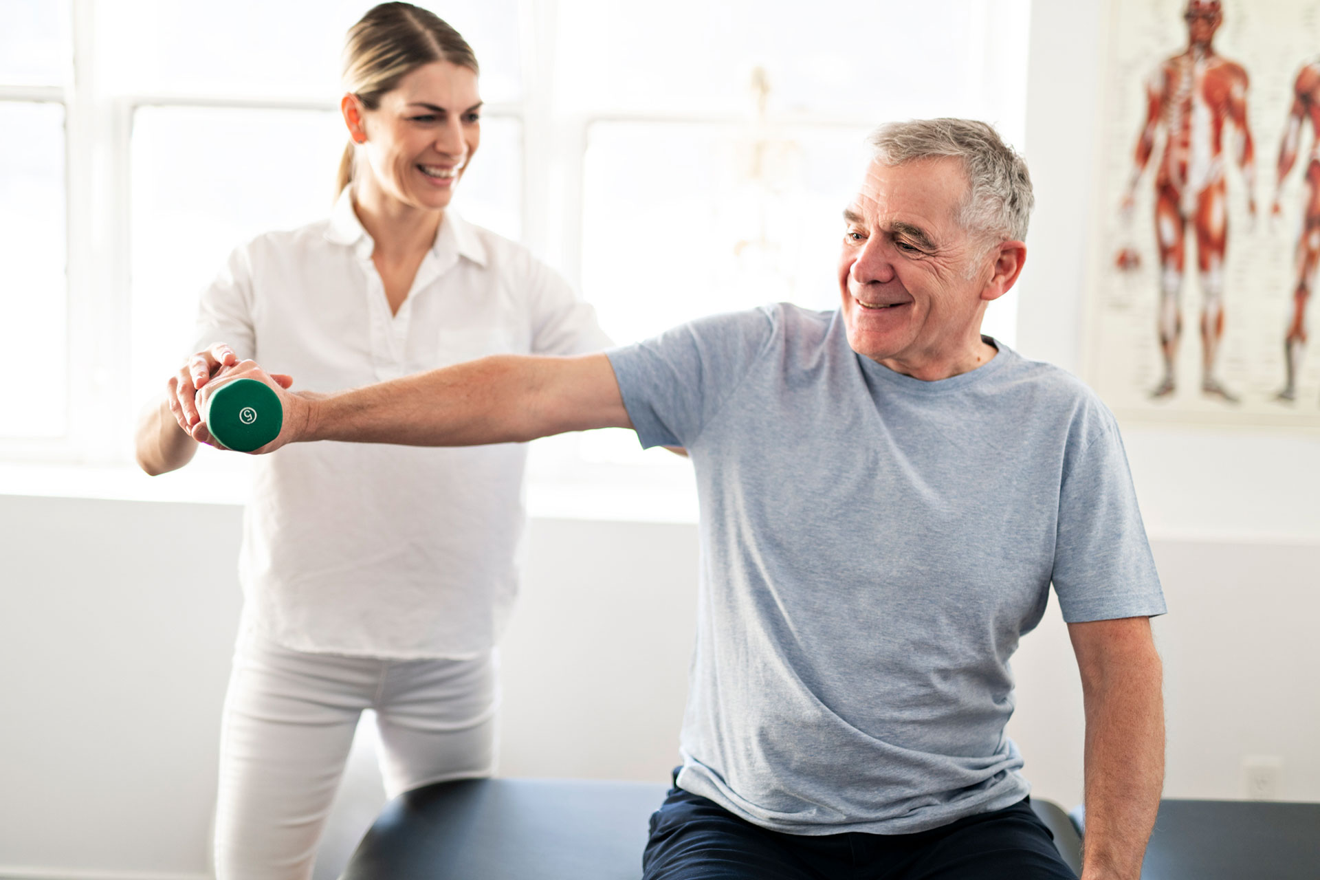 rehabilitation physiotherapy worker with senior client