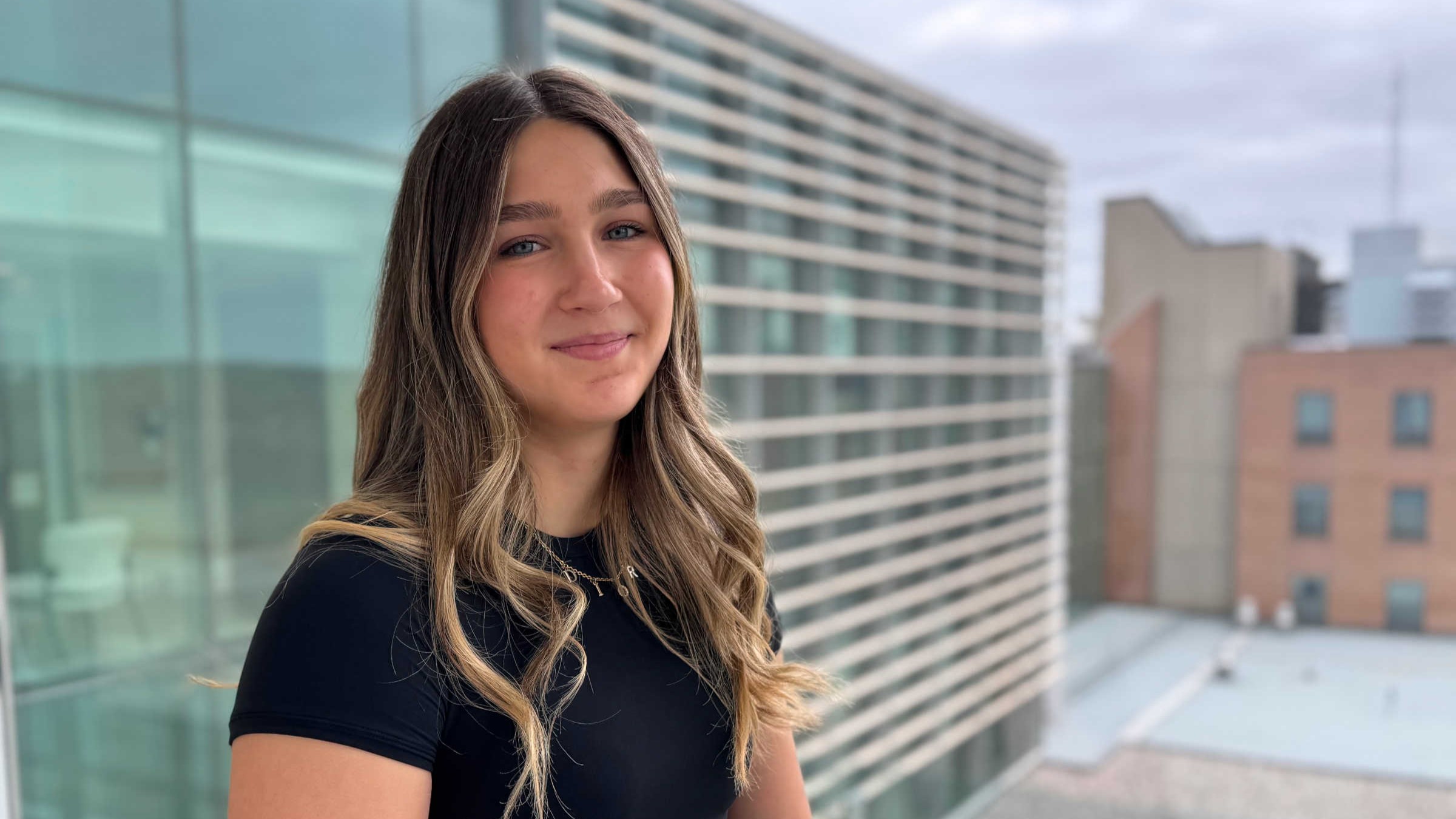 picture of Isabelle Larabie standing in Wing A4 after an interview