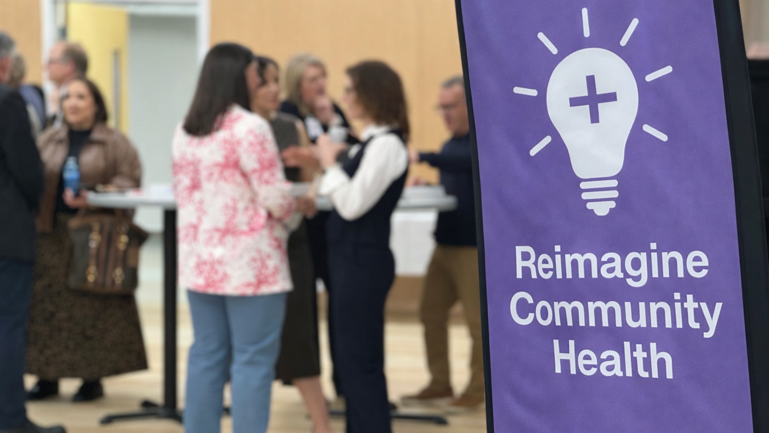 reimagine community health banner at the MECcelerate Innovation event