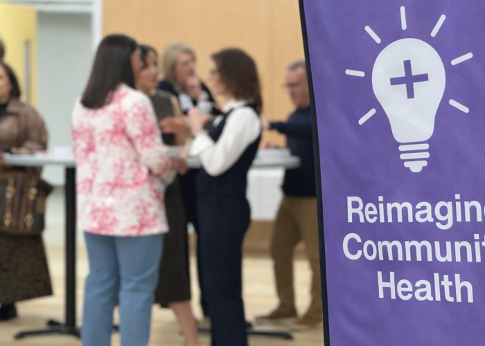 reimagine community health banner at the MECcelerate Innovation event