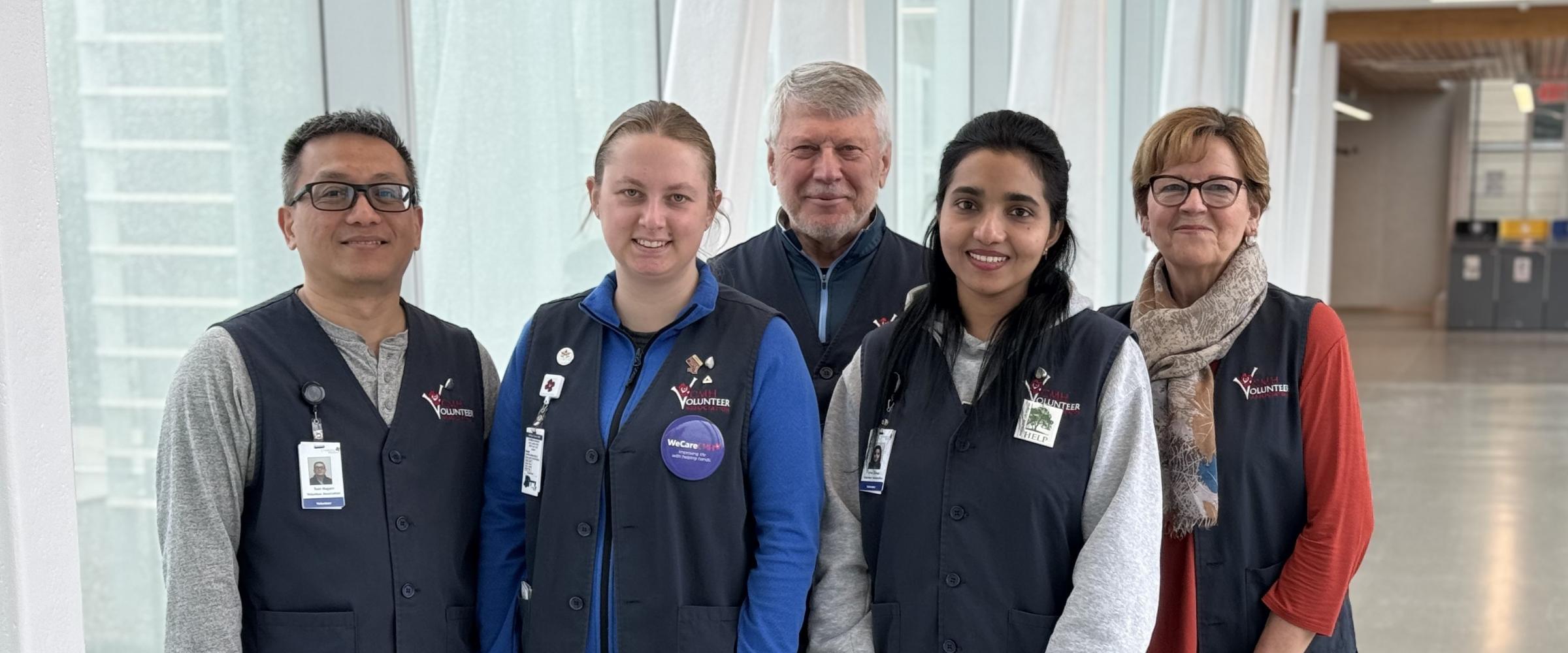 Group photo of five volunteers on the bridge 2024